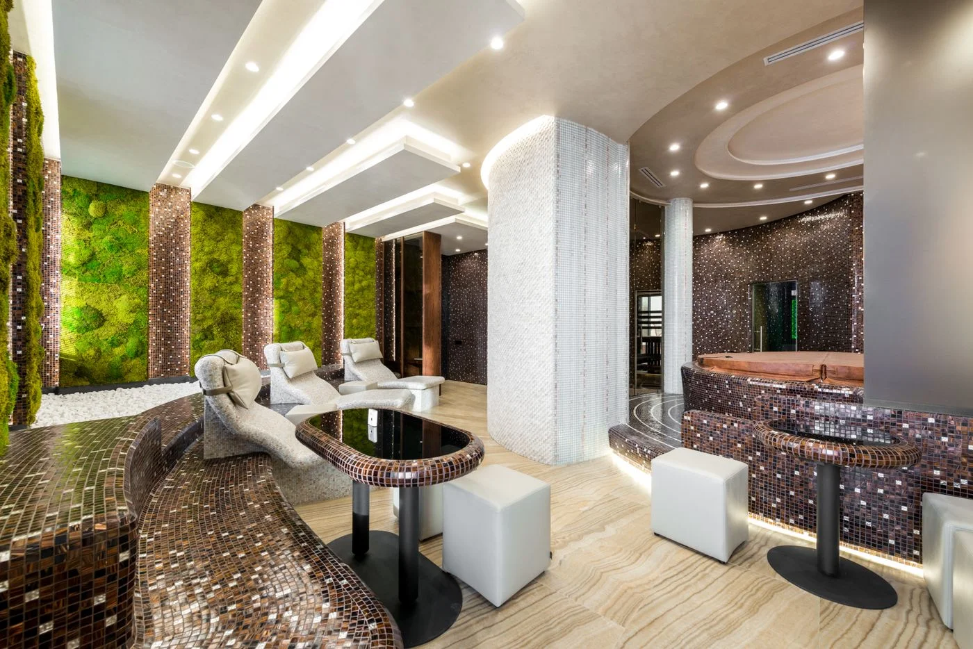 Wellness interior with heated loungers and living green walls